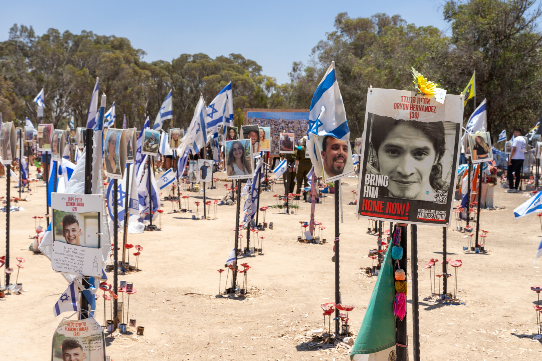 Portraits and Israeli flags at the Nova festival memorial near Re’im